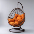 Hamak lub fotel wisz?cy, Br?zowy i pomara¨½czowy owalny ogr¨®d wisz?cy fotel z podpor? 95 x 95 x 195 cm w stali i polietylenu